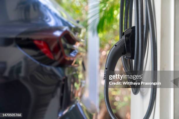 ev charger station at home - electric car charger imagens e fotografias de stock