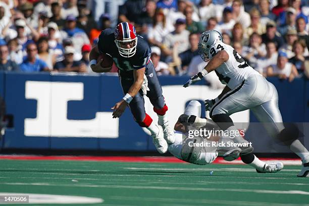 Linebacker Bill Romanowski and defensive end Tony Bryant of the Oakland Raiders up end quarterback Drew Bledsoe of the Buffalo Bills during the NFL...