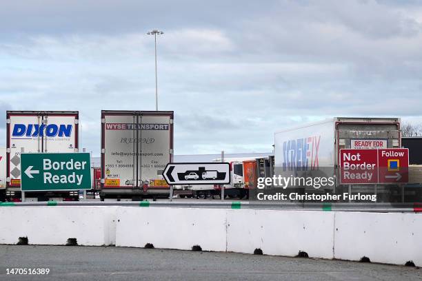 Customs signs direct lorry drivers to the correct lane for administration and load checks before boarding ferries at Holyhead Port on March 01, 2023...