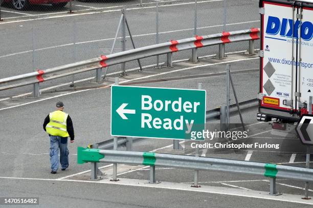 Customs signs direct lorry drivers to the correct lane for administration and load checks before boarding ferries at Holyhead Port on March 01, 2023...