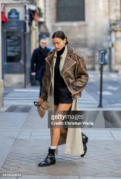 Irina Shayk is seen during a street style shoot on March 01, 2023 in Paris, France.