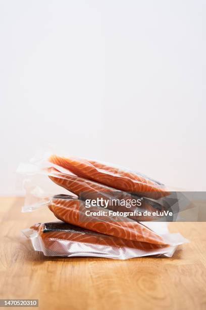 four atlantic salmon slice vacuum-packed - vacuum packed stock pictures, royalty-free photos & images