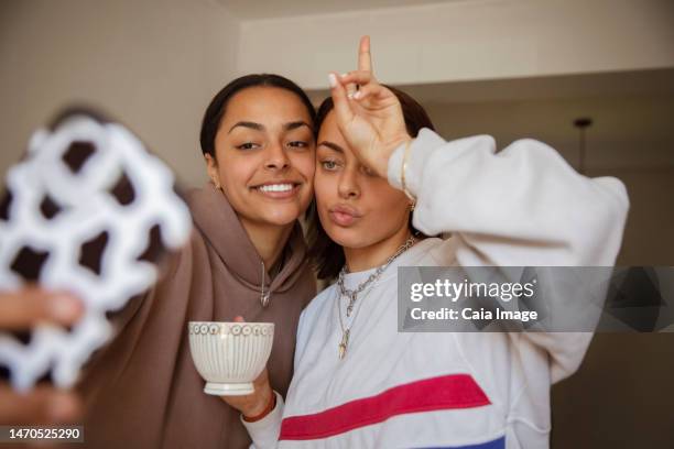 cool young women posing for selfie - basingstoke stock-fotos und bilder