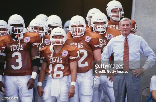 John Mackovic, Head Coach for the University of Texas Longhorns stands with the team before kick off for the NCAA Southwest Conference college...