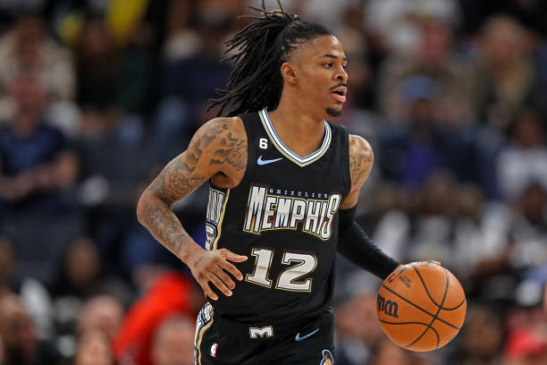 Ja Morant of the Memphis Grizzlies brings the ball up court during the game against the Los Angeles Lakers at FedExForum on February 28, 2023 in...