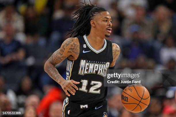 Ja Morant of the Memphis Grizzlies brings the ball up court during the game against the Los Angeles Lakers at FedExForum on February 28, 2023 in...