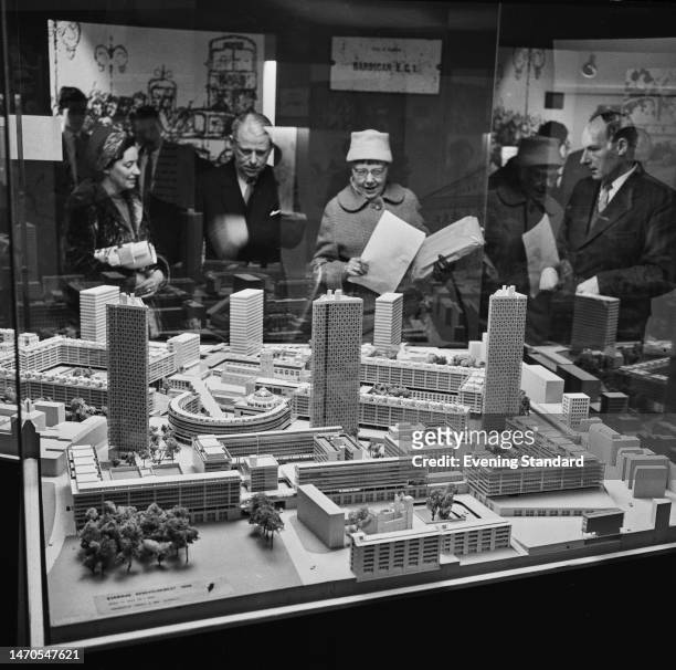 Visitors look at a model of the proposed Barbican Estate development in the Bunhill District of the City of London, March 15th 1960.
