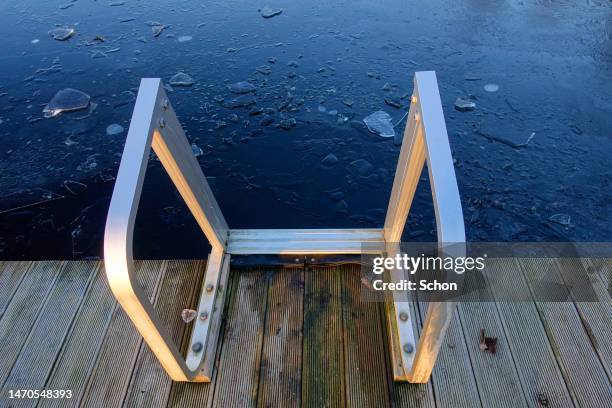 stairs on a jetty at a winter bath - winter swimming stock pictures, royalty-free photos & images