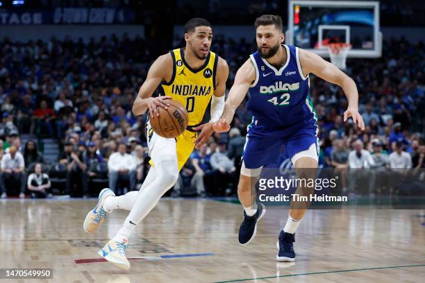 Tyrese Haliburton of the Indiana Pacers drives to the basket against Maxi Kleber of the Dallas Mavericks in the first half at American Airlines...