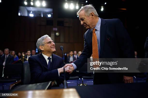 Attorney General Merrick Garland greets Senate Judiciary Committee Chairman Richard Durbin before a hearing in the Hart Senate Office Building on...