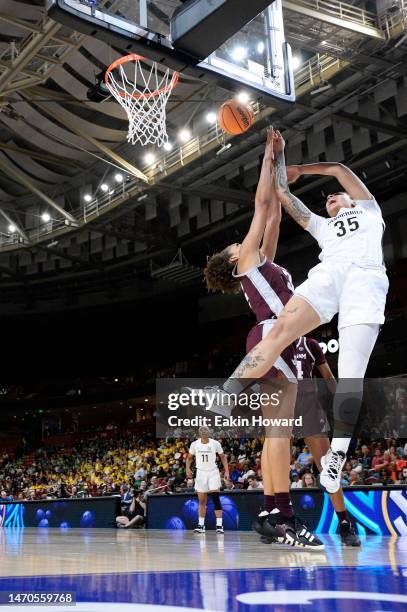 Sacha Washington of the Vanderbilt Commodores gets fouled by Tineya Hylton of the Texas A&M Aggies in the third quarter during the first round of the...