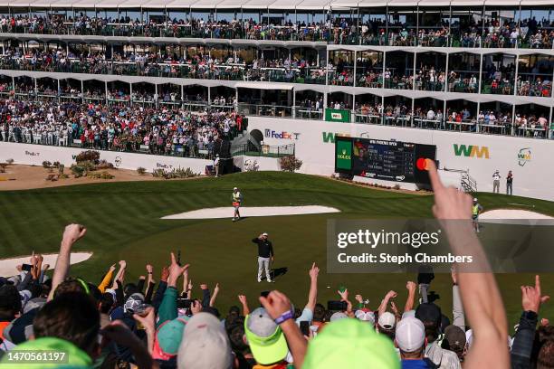 Fans cheer after Jon Rahm of Spain made his putt on the 16th green during the second round of the WM Phoenix Open at TPC Scottsdale on February 10,...