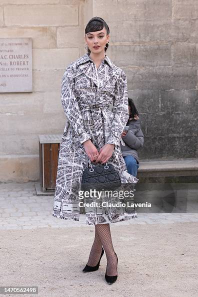 Deva Cassel wears a black and white printed Dior trench coat, black ...