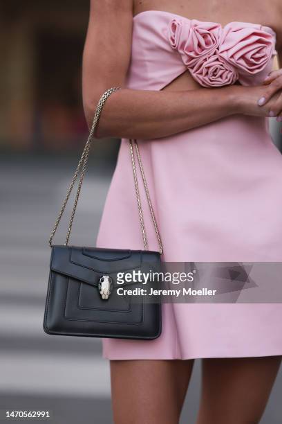Saraja Roberta Elez seen wearing Magda Butrym light pink short dress with a cut-out and flower details, Bulgari Serpenti Forever black leather...