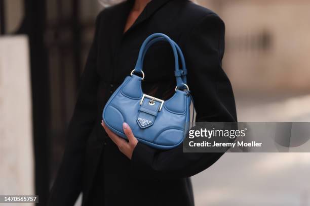 Saraja Roberta Elez seen wearing Mugler black oversize blazer jacket, Prada Moon blue leather bag, during Paris Fashion Week - Womenswear Fall Winter...