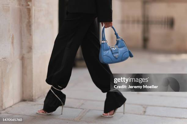 Saraja Roberta Elez seen wearing Mugler black oversized blazer jacket, Tom Ford black wide leg pants, René Caovilla white / silver glitter high...