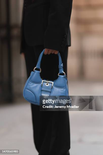 Saraja Roberta Elez seen wearing Mugler black oversize blazer jacket, Tom Ford black wide leg pants, Prada Moon blue leather bag, during Paris...