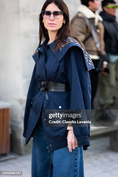 Deborah Reyner Sebag wears a blue Dior jacket, black belt and jeans, outside Dior, during Paris Fashion Week - Womenswear Fall Winter 2023 2024, on...