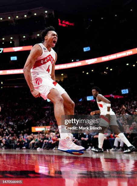 Scottie Barnes of the Toronto Raptors celebrates against the Chicago Bulls during the second half of their basketball game at the Scotiabank Arena on...