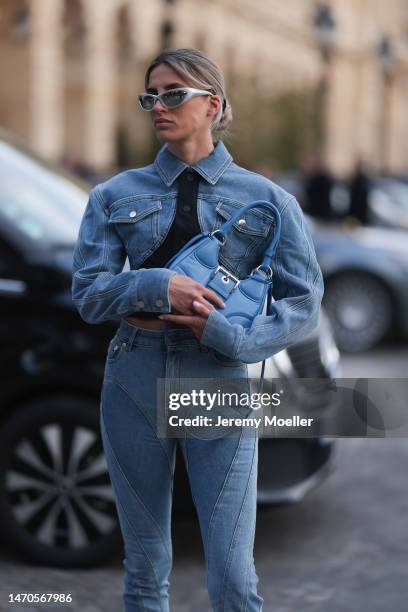 Saraja Roberta Elez seen wearing Balenciaga silver sunglasses, Mugler blue jeans denim cropped jacket, Mugler blue denim wide leg slit jeans pants,...