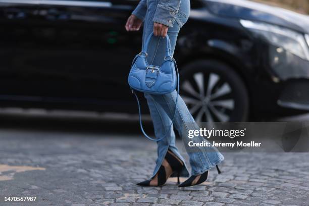 Saraja Roberta Elez seen wearing Mugler blue jeans denim cropped jacket, Mugler blue denim wide leg slit jeans pants, Jimmy Choo x Mugler black...