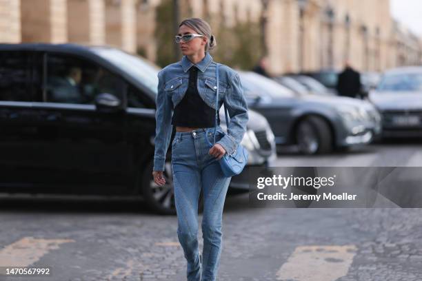 Saraja Roberta Elez seen wearing Balenciaga silver sunglasses, Mugler blue jeans denim cropped jacket, Mugler blue denim wide leg slit jeans pants,...