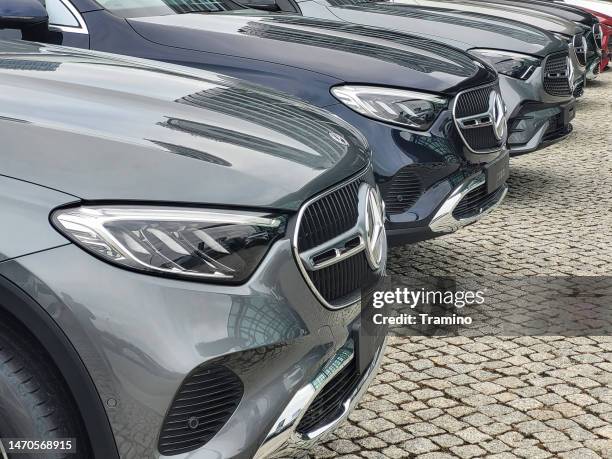 mercedes-benz cars on a parking - mercedes benz showroom stock pictures, royalty-free photos & images