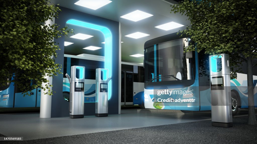 Electric city bus recharging at the bus charge station, connected with a power cable