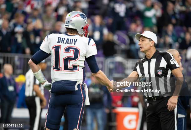 Tom Brady quarterback for the New England Patriots shakes hands with referee Gene Steratore before the start of Super Bowl LII. The Philadelphia...