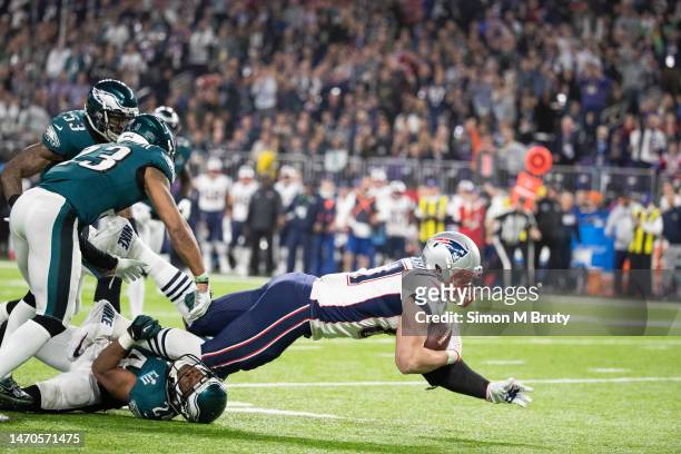 Rob Gronkowski of the New England Patriots is tackled by Rodney McLeod and Corey Graham of the Philadelphia Eagles during Super Bowl LII at U.S. Bank...