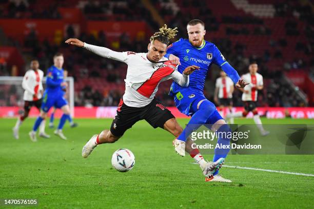 Sekou Mara of Southampton is challenged by Niall Maher of Grimsby Town during the Emirates FA Cup Fifth Round match between Southampton and Grimsby...