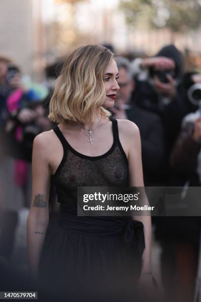 Chiara Ferragni seen wearing a transparent black tank top and a wide black skirt before the Dior show on February 28, 2023 in Paris, France.
