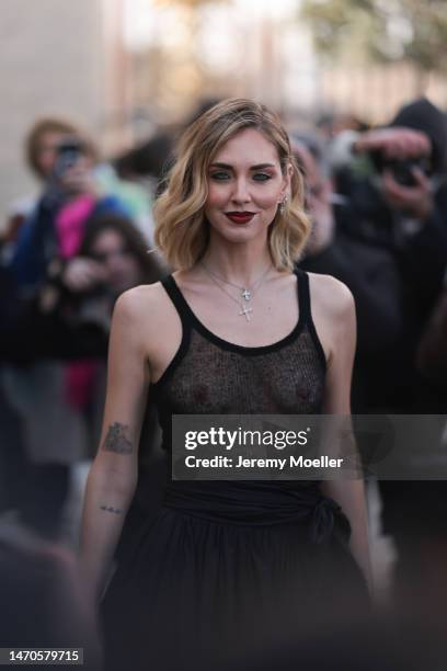 Chiara Ferragni seen wearing a transparent black tank top and a wide black skirt before the Dior show on February 28, 2023 in Paris, France.