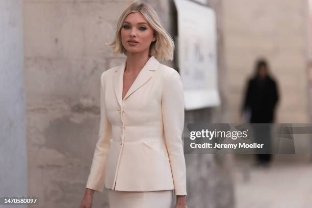 Elsa Hosk seen wearing a beige matching set with a beige blazer and a beige long skirt, a black bag and black shoes before the Dior show on February...