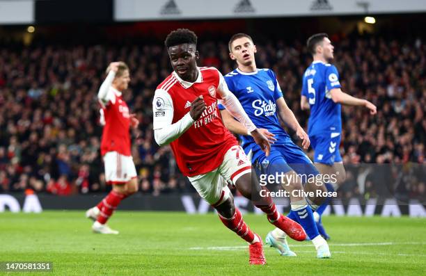 Bukayo Saka of Arsenal celebrates after scoring the team's first goal during the Premier League match between Arsenal FC and Everton FC at Emirates...