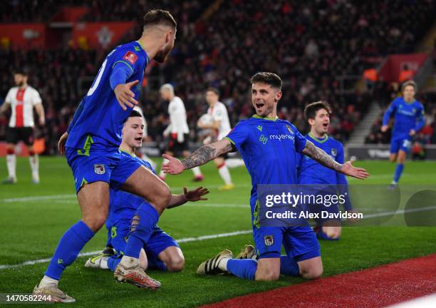 Gavan Holohan of Grimsby Town celebrates with teammates scoring the side's second goal during the Emirates FA Cup Fifth Round match between...