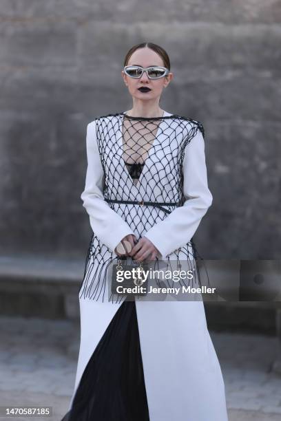 Katya Bychkova seen wearing Beare Park white long coat, black long transparent Hesperios Skirt black small Dior Micro Lady Dior Bag, black Bottega...