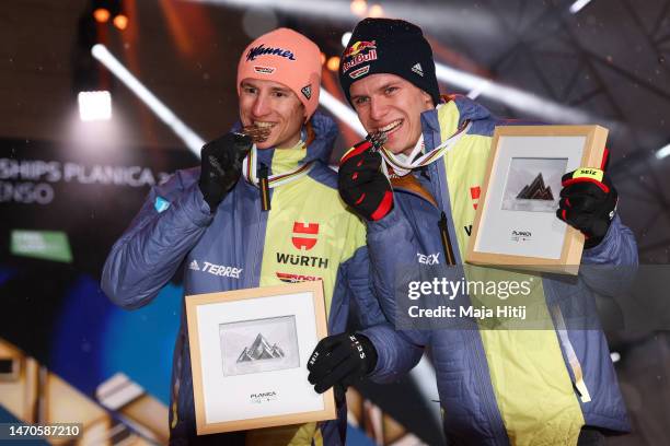 Bronze Medalist, Karl Geiger of Germany, Silver Medalist, Andreas Wellinger of Germany, during the medal ceremony for Men's HS100 at the FIS Nordic...