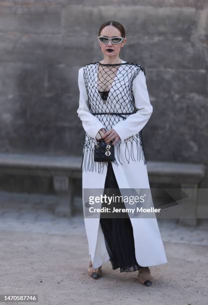 Katya Bychkova seen wearing Beare Park white long coat, black long transparent Hesperios Skirt black small Dior Micro Lady Dior Bag, black Bottega...