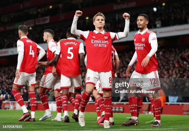 Martin Odegaard of Arsenal celebrates after scoring the team's third goal during the Premier League match between Arsenal FC and Everton FC at...