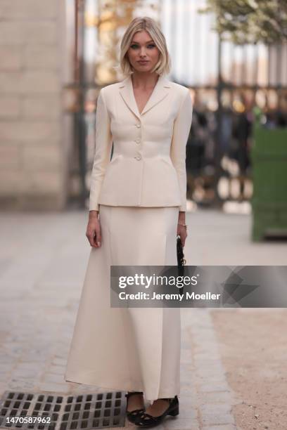 Elsa Hosk seen wearing a beige matching set with a beige blazer and a beige long skirt, a black bag and black shoes before the Dior show on February...