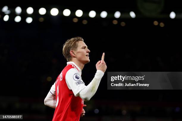 Martin Odegaard of Arsenal celebrates after scoring the team's third goal during the Premier League match between Arsenal FC and Everton FC at...