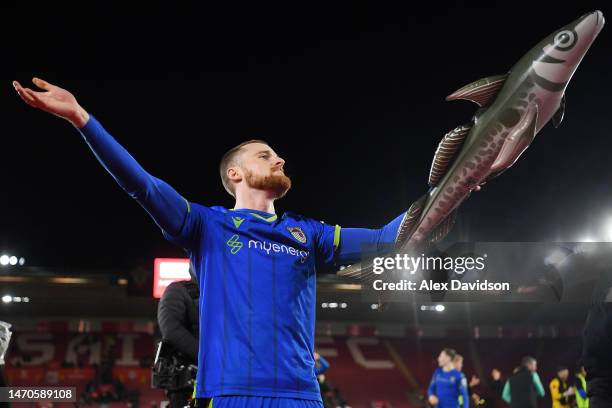 Niall Maher of Grimsby Town celebrates with Harry Haddock an inflatable fish following the Emirates FA Cup Fifth Round match between Southampton and...