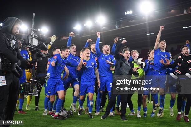 Paul Hurst, Manager of Grimsby Town, celebrates victory with his players at full time following the Emirates FA Cup Fifth Round match between...