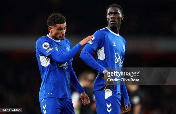 Ben Godfrey and Amadou Onana of Everton look dejected following the team's defeat in the Premier League match between Arsenal FC and Everton FC at...