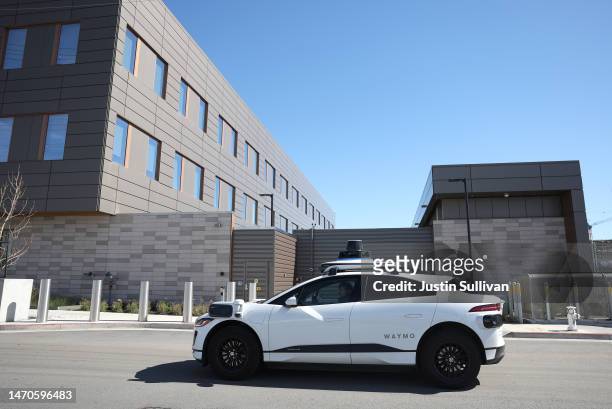 Waymo car drives along a street on March 01, 2023 in San Francisco, California. Waymo, Alphabet's self-driving car division, announced that it has...