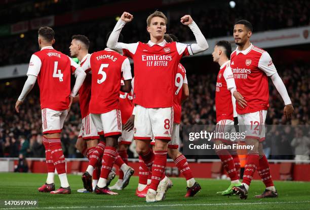 Martin Odegaard of Arsenal celebrates after scoring the team's third goal during the Premier League match between Arsenal FC and Everton FC at...