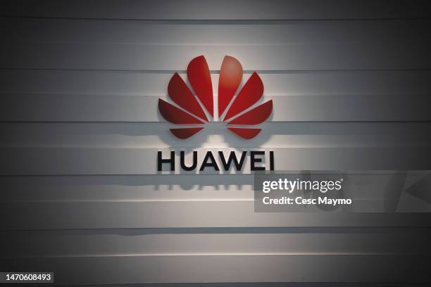 Huawei's logo sits illuminated outside the Huawei booth during the day 3 of the Mobile World Congress 2023 at Fira Barcelona on March 1, 2023 in...