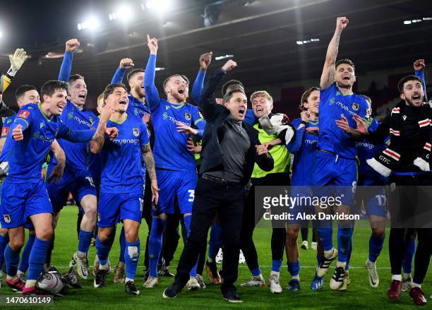 Paul Hurst, Manager of Grimsby Town, celebrates victory with his players at full time following the Emirates FA Cup Fifth Round match between...