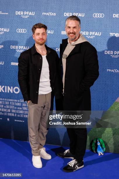 Dominik Flade and Stefan Bockelmann attend the "Der Pfau" premiere at Cinedom on March 01, 2023 in Cologne, Germany.